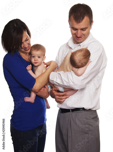 Parents holding their baby Identical twins © BCFC