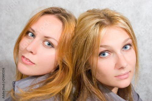 two girls over white background