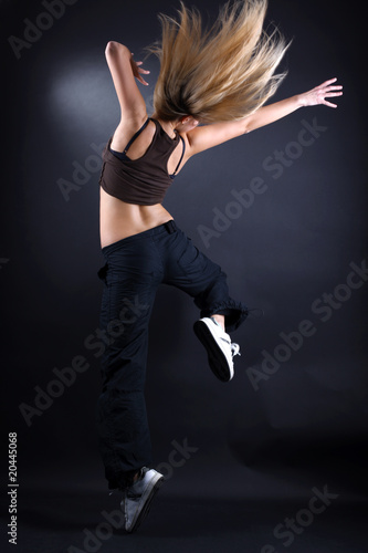 woman modern dancer against black background © konstantant