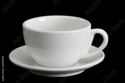 White cup on black background