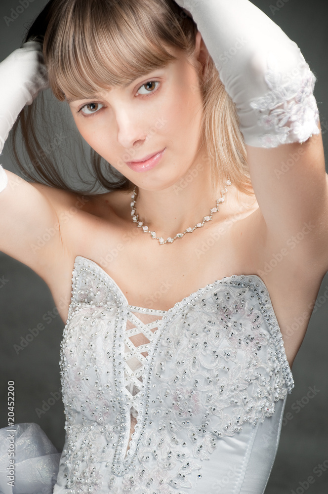 beautiful young bride in white wedding gown and gloves beautiful young bride in white wedding gown and gloves