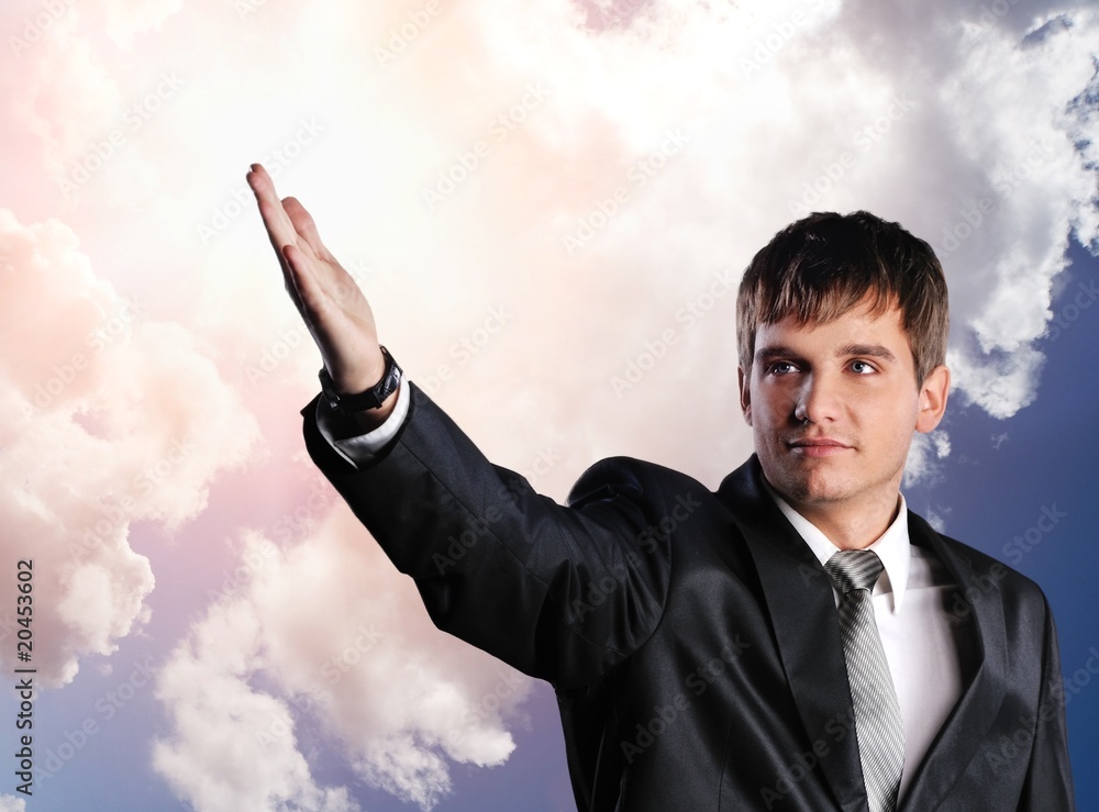 Handsome young businessman with outstretched hand Handsome young businessman with outstretched hand