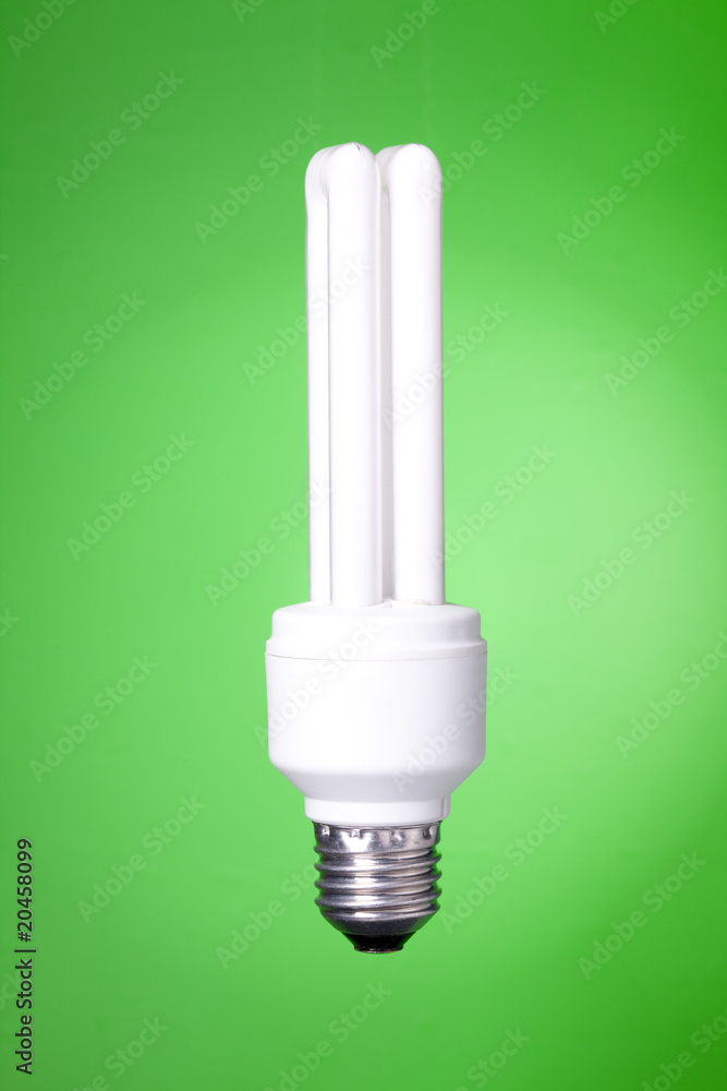 Energy saving lamp on green background Energy saving lamp on green background