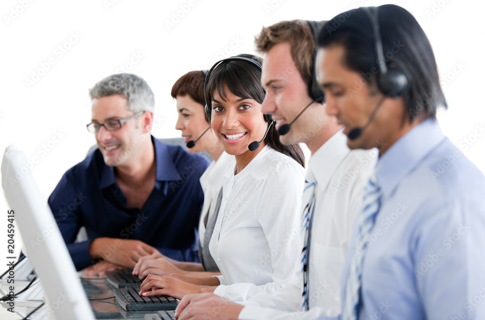Cheerful business people working in a call center Cheerful business people working in a call center