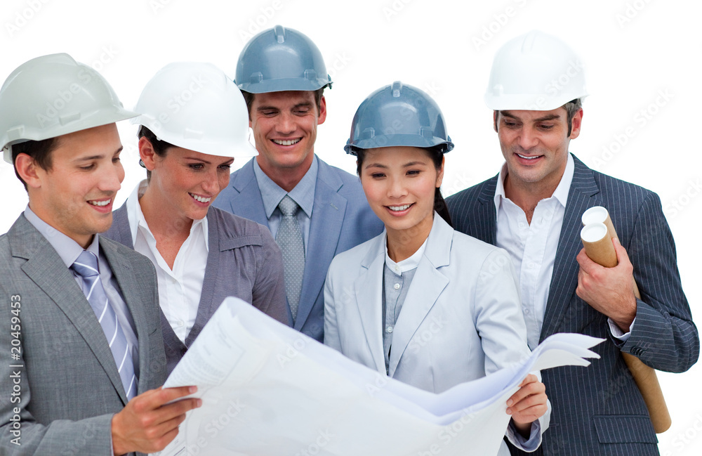 Multi-ethnic architects studying blueprints Multi-ethnic architects studying blueprints