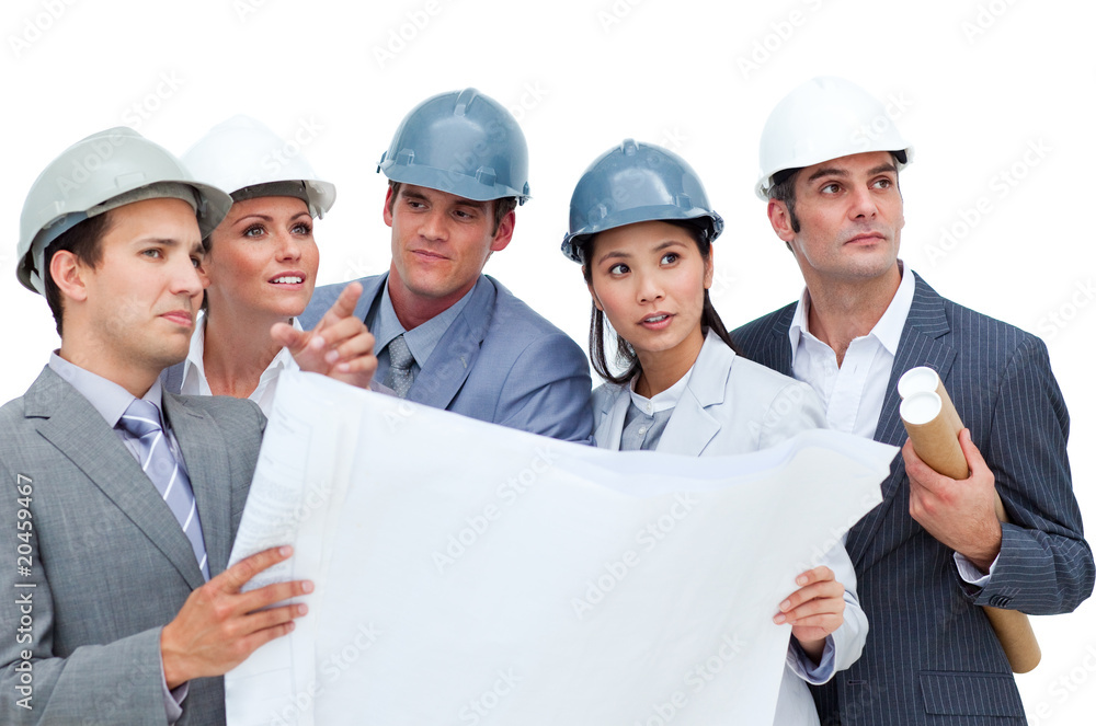 Confident architects studying blueprints Confident architects studying blueprints