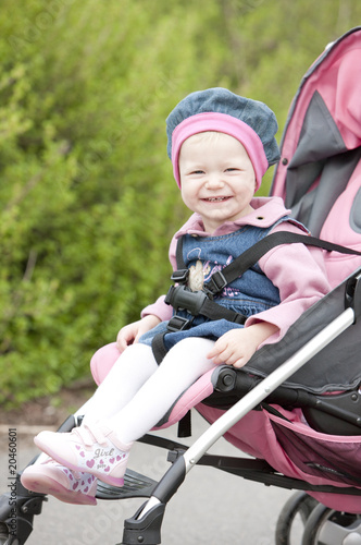 toddler sitting in a pram