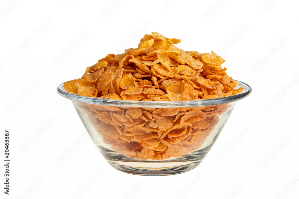 Cornflakes in glass bowl isolated over white background. Cornflakes in glass bowl isolated over white background.