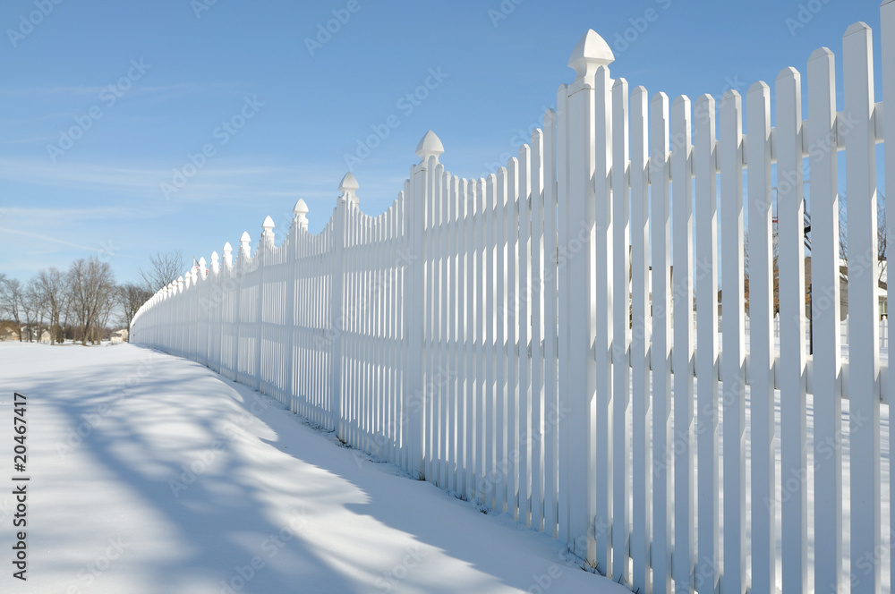 white fence on the snow white fence on the snow