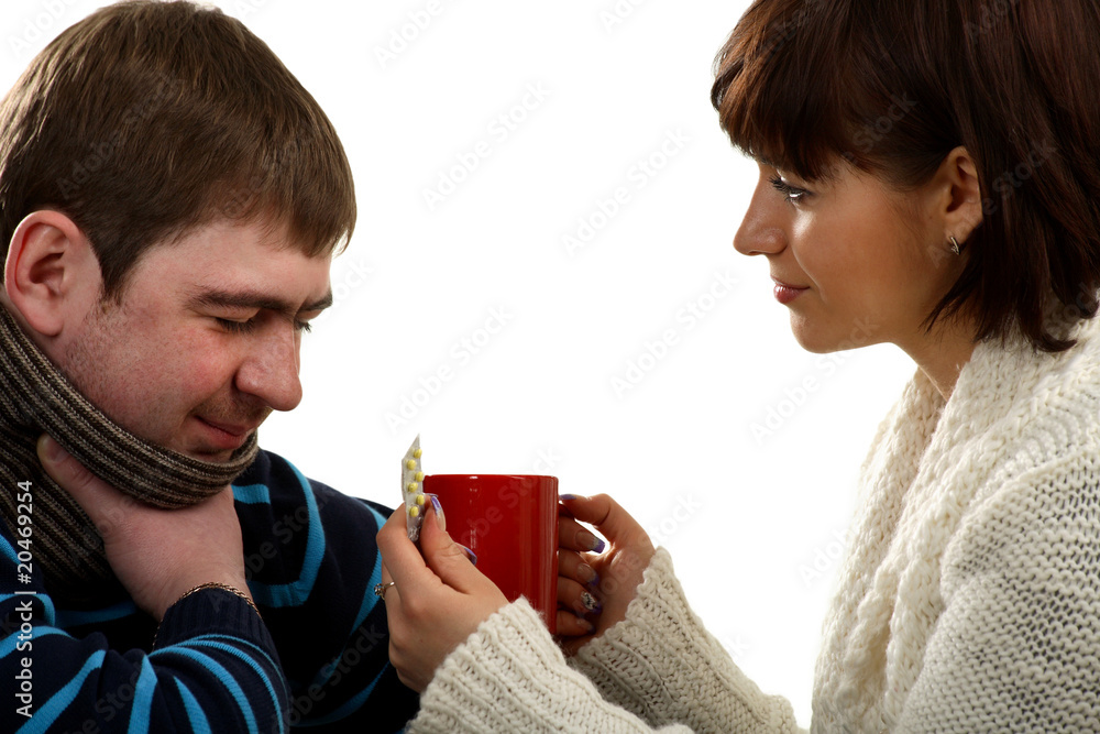 Woman allows to drink a medical drink to the ill man Woman allows to drink a medical drink to the ill man