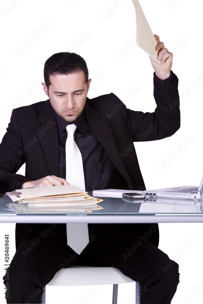 Upset Businessman at His Desk in Suit Upset Businessman at His Desk in Suit