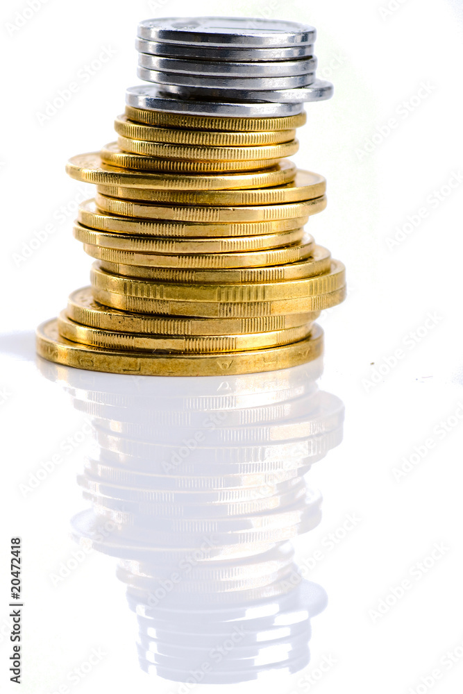 Pile of coins with reflection isolated on white. Pile of coins with reflection isolated on white.