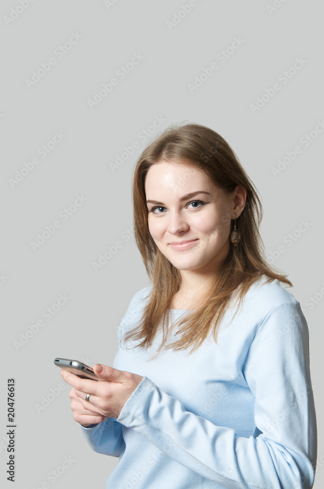 Girl holding cell phone Girl holding cell phone