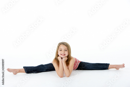 Young Girl In Gymnastic Pose Doing Splits