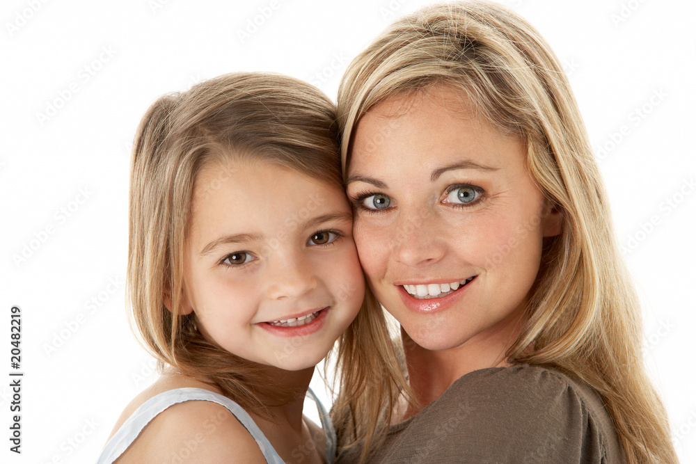 Studio Portrait Of Mother Hugging Young Daughter Studio Portrait Of Mother Hugging Young Daughter