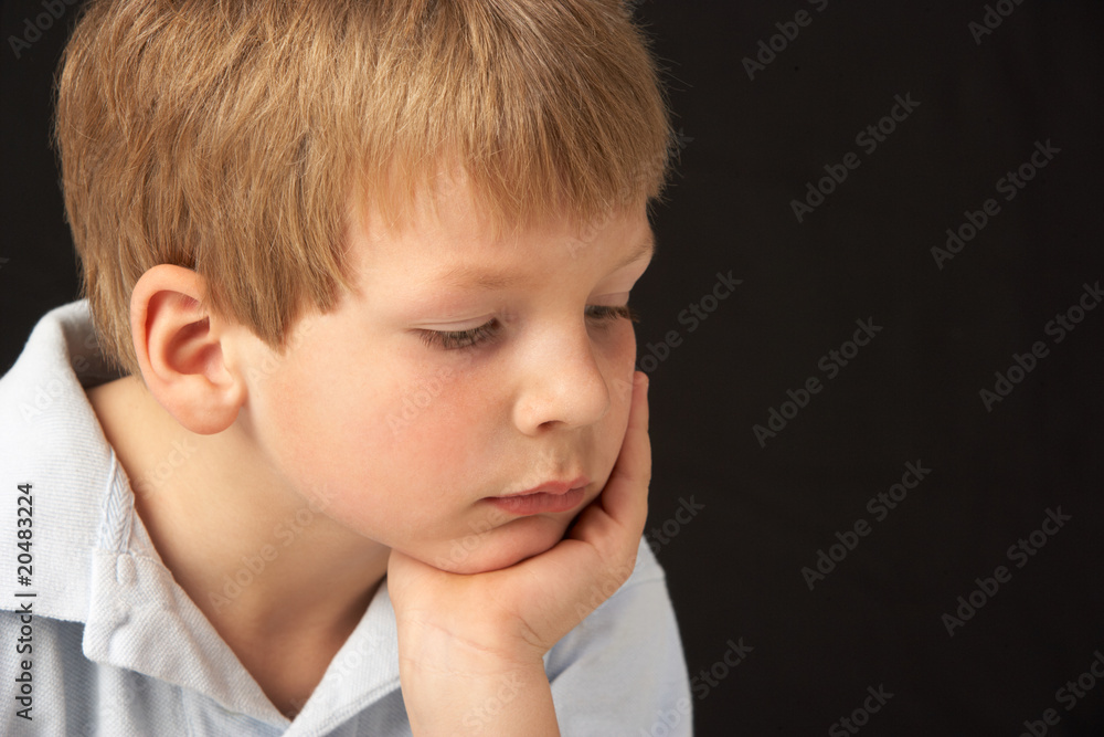 Studio Portrait Of Thoughtful Young Boy Studio Portrait Of Thoughtful Young Boy
