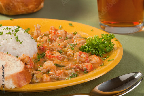 Plate of delicious thick cajun crawfish etouffee with rice