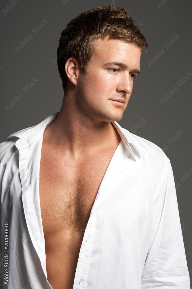 Obraz premium Studio Portrait Of Young Man Wearing Open Shirt