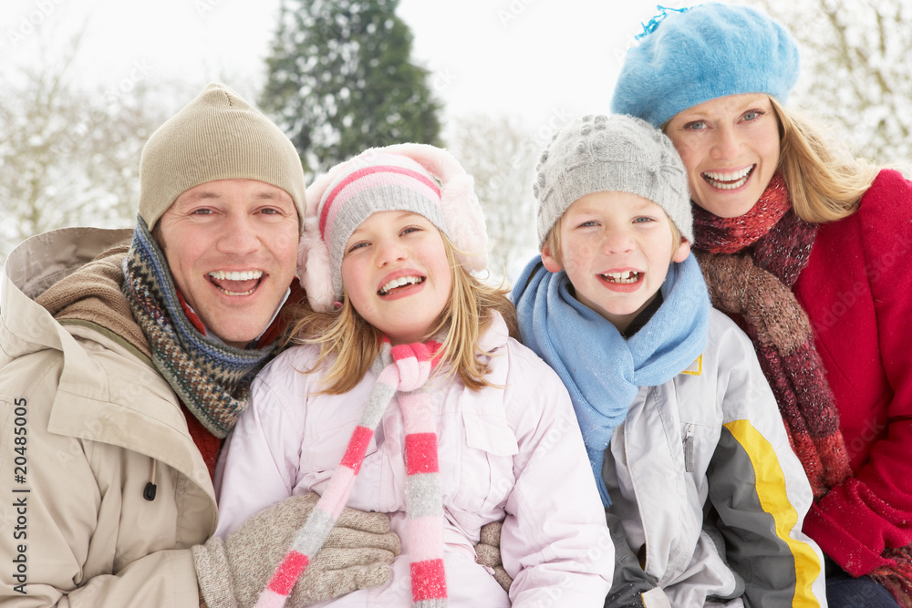 Family Sitting In Snowy Landscape Family Sitting In Snowy Landscape