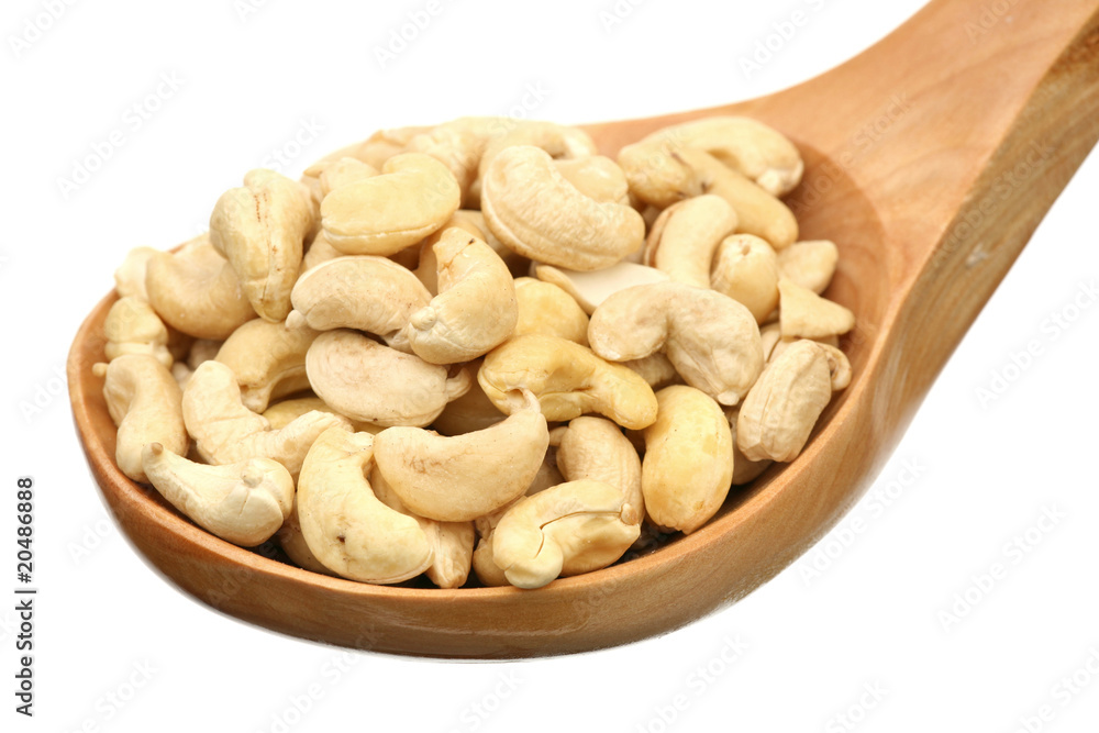 Cashew in a wooden spoon Cashew in a wooden spoon