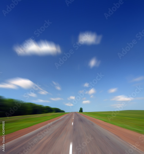 high speed on road under sky