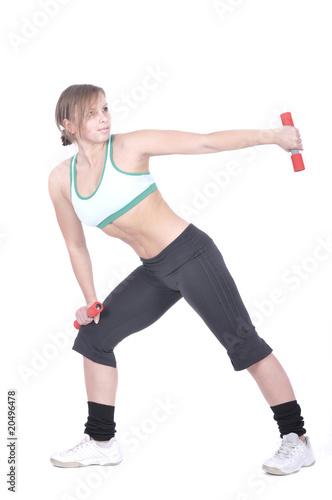 Attractive young woman with barbell