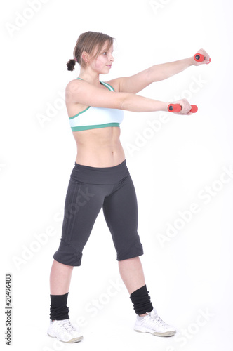 Attractive young woman with barbell