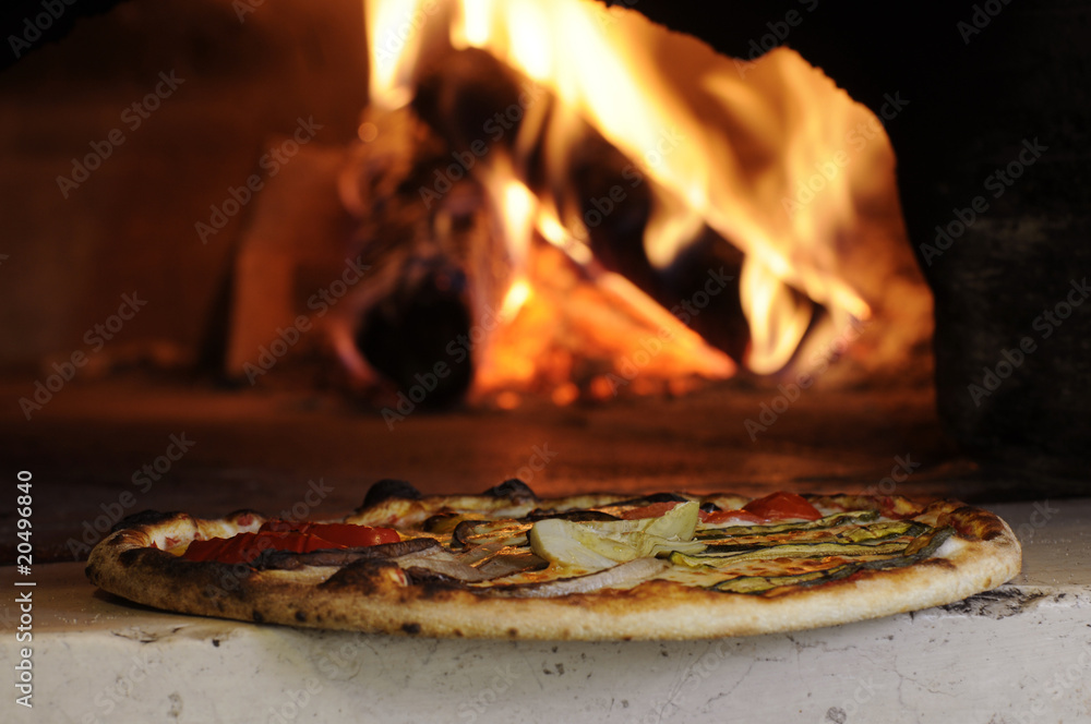 Pizza cotta nel forno a legna Stock Photo | Adobe Stock