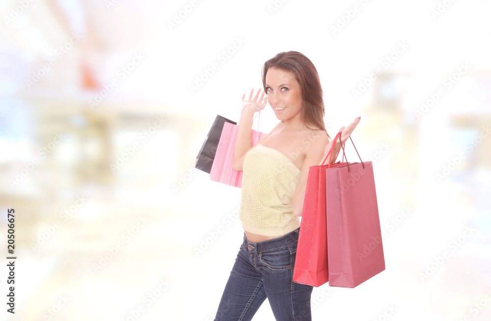 young woman smiling in the shopping mall. young woman smiling in the shopping mall.