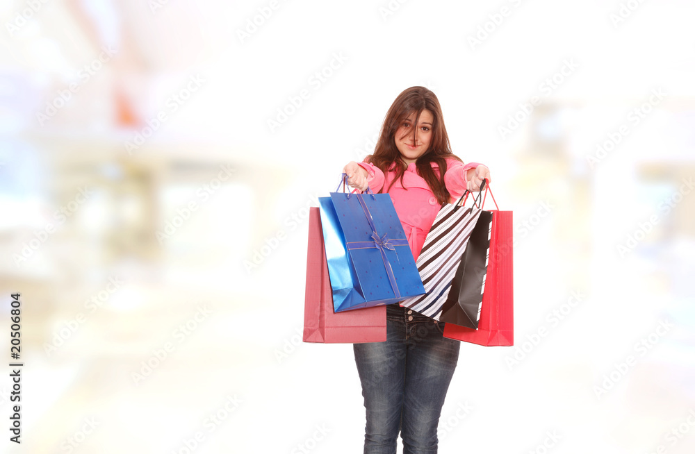 young woman smiling in the shopping mall. young woman smiling in the shopping mall.