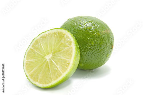 fresh juicy green lime over white background