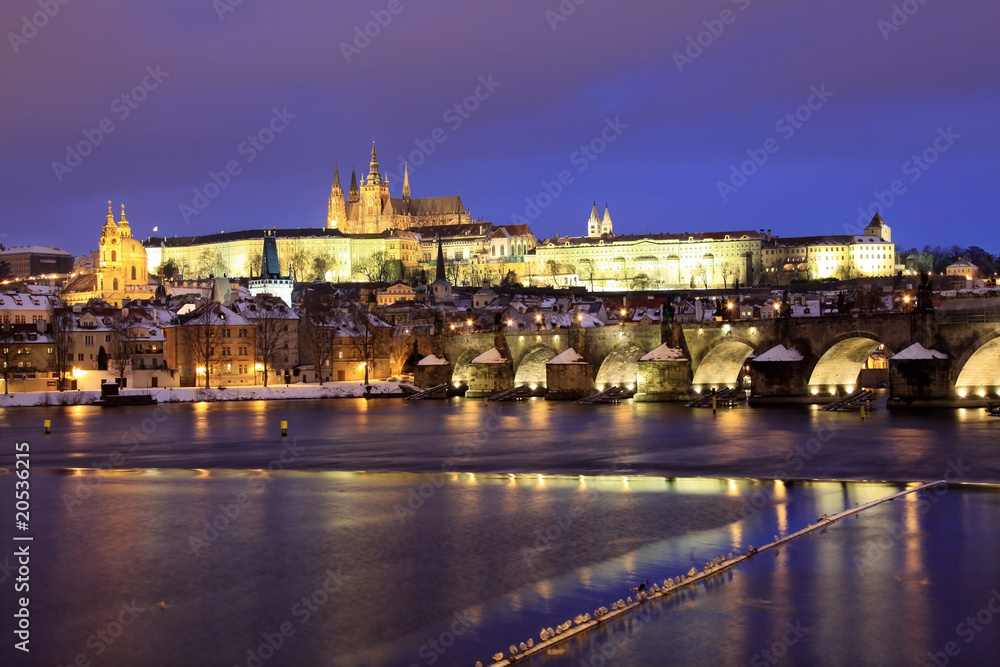 Snowy Prague gothic Castle with Charles Bridge in the Night
