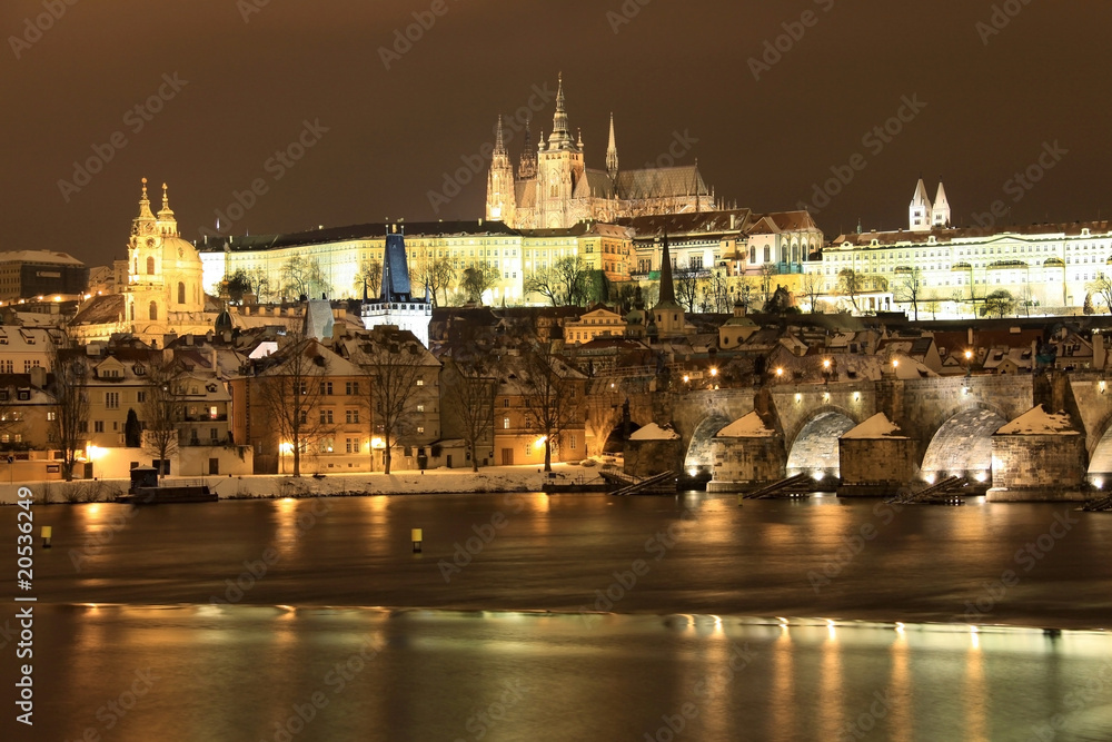 Snowy Prague gothic Castle with Charles Bridge in the Night