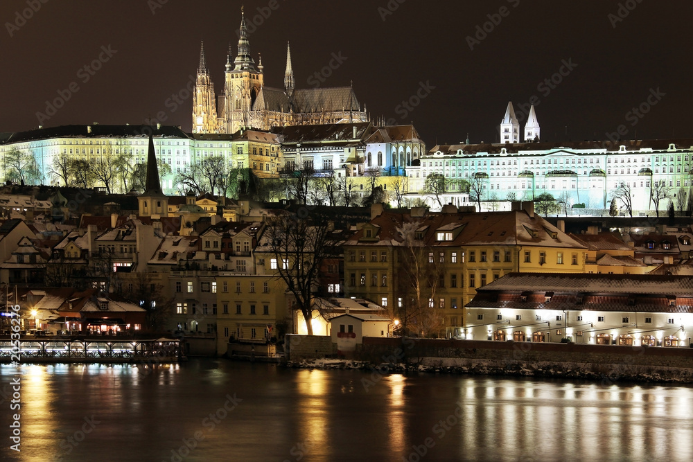 Snowy Prague gothic Castle on the River Vltava in the Night