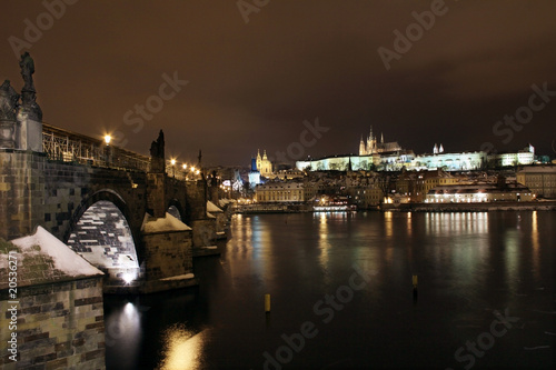Snowy Prague Castle with Charles Bridge in the Night