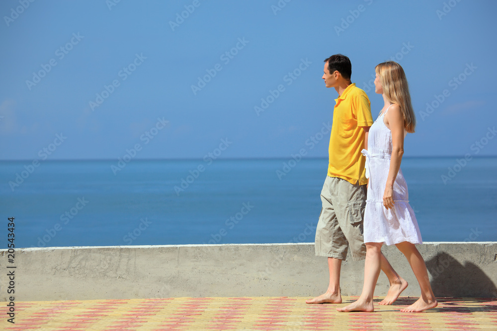 young man and beautiful woman on quay young man and beautiful woman on quay