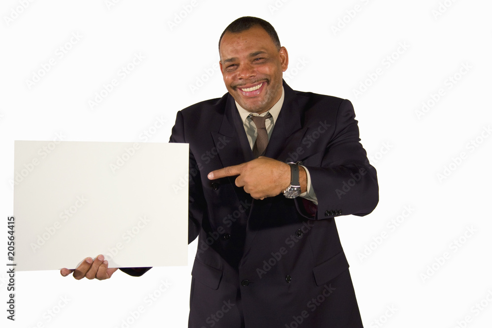 smiling African-American businessman pointing at board smiling African-American businessman pointing at board