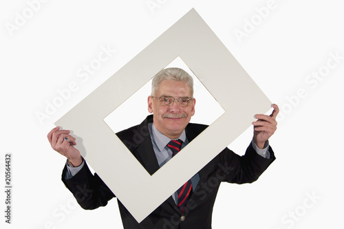 Quadro su tela smiling senior manager looking through passepartout