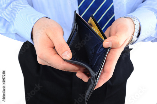 Businessman well-dressed with empry wallet isolated over white