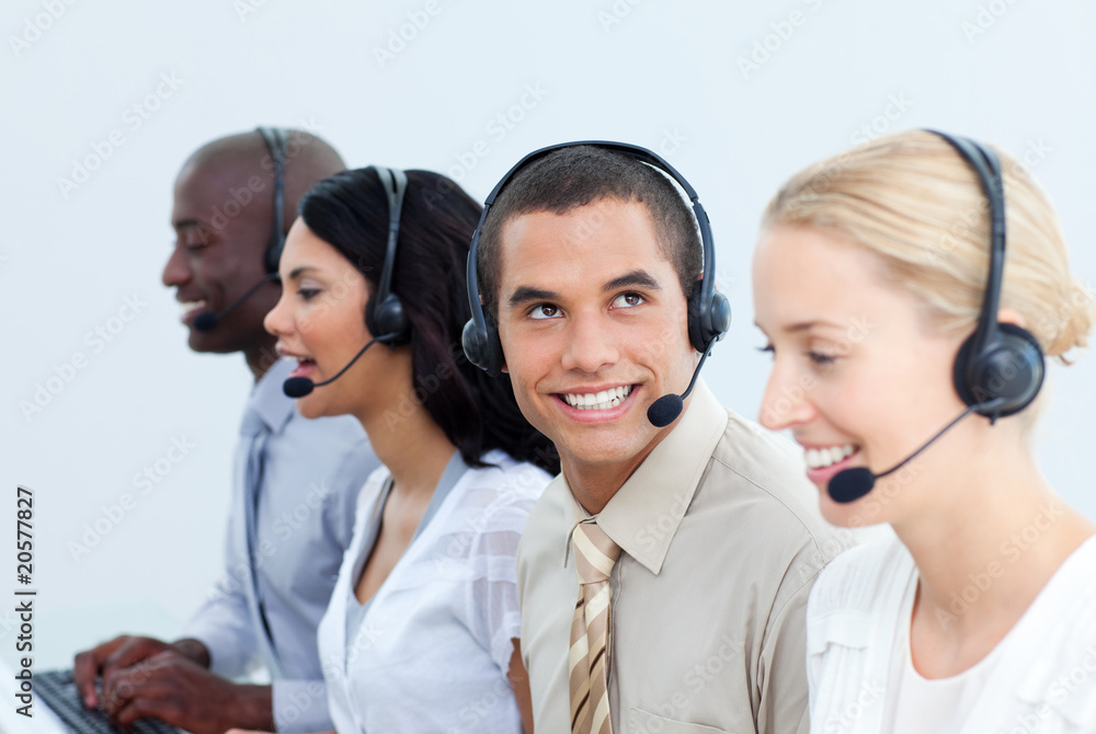 Smiling business people working in a call center Smiling business people working in a call center