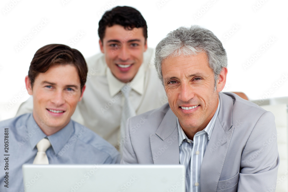 Self-assured business partners working at a computer Self-assured business partners working at a computer