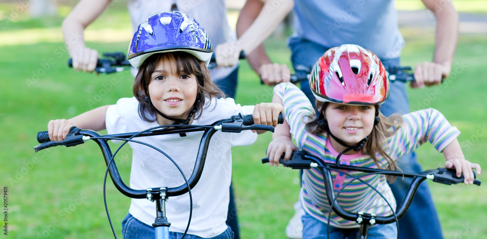 Naklejka premium Jolly children riding a bike