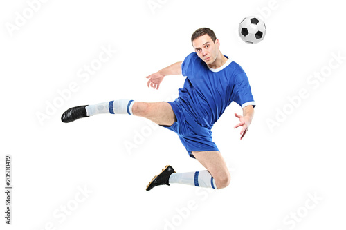 Soccer player with a ball in jump isolated on white background