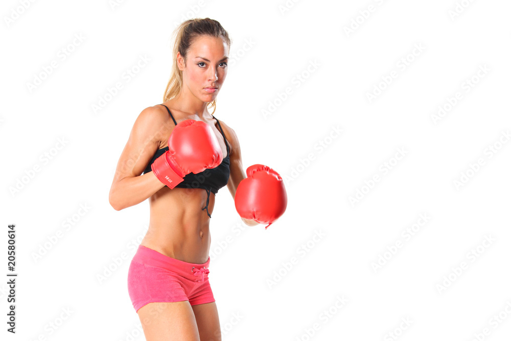 Beautiful young woman with red boxing gloves isolated on white Beautiful young woman with red boxing gloves isolated on white