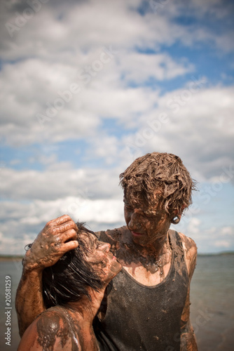 couple playing in the mud