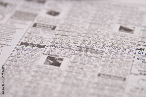 Newspaper page of classified ads