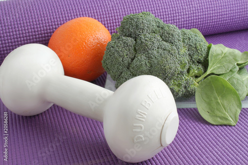 Fruit and vegetables with exercise equipment photo