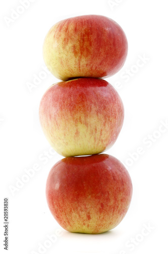 three balanced apples