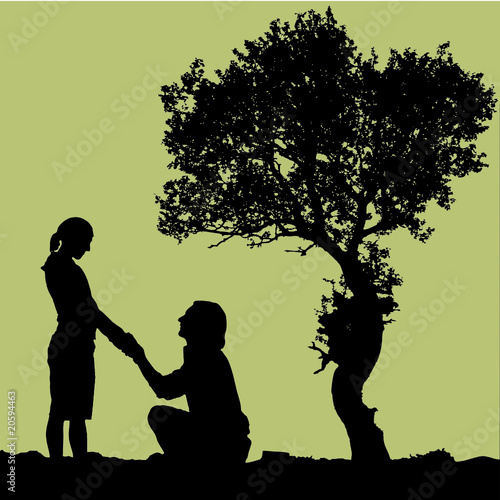 joung couple under a tree before wedding
