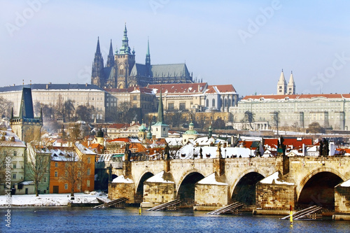 Frozen Snowy Prague gothic Castle with Charles Bridge